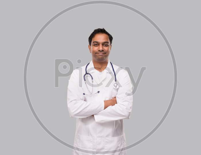 Indian Man Doctor Not Smiling Hands Crossed Isolated. Healthy Life, Medicine Concept.