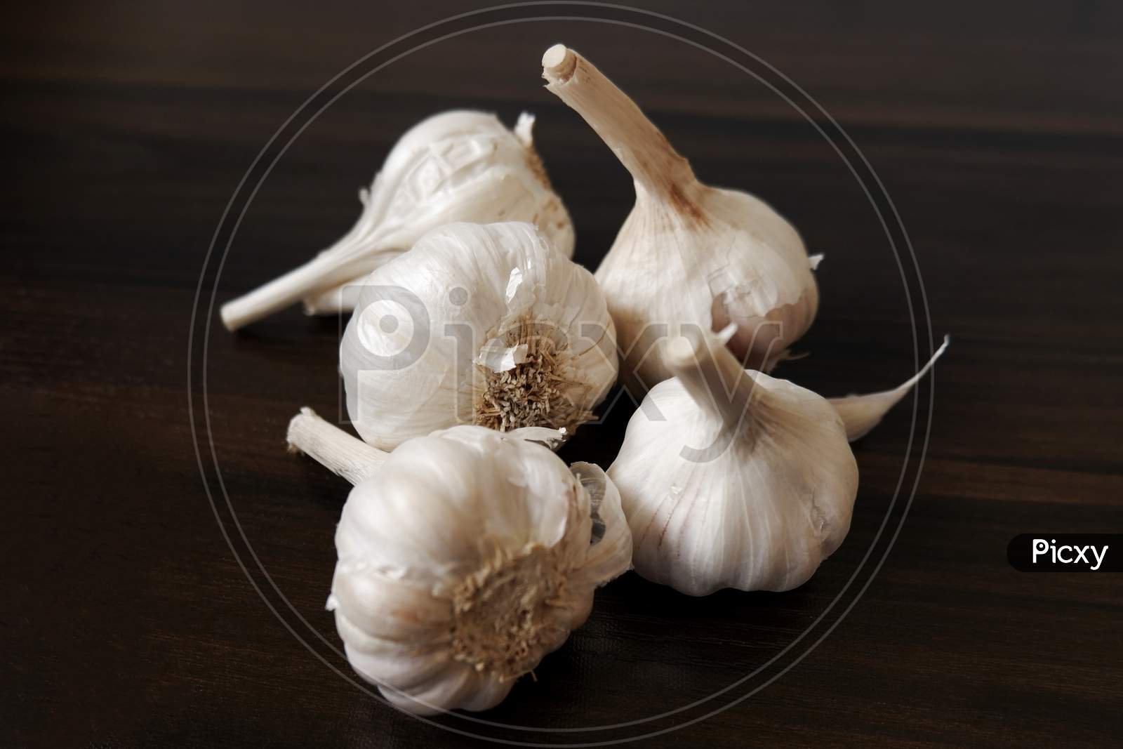 Top Shot Of Garlic'S On Wooden Background