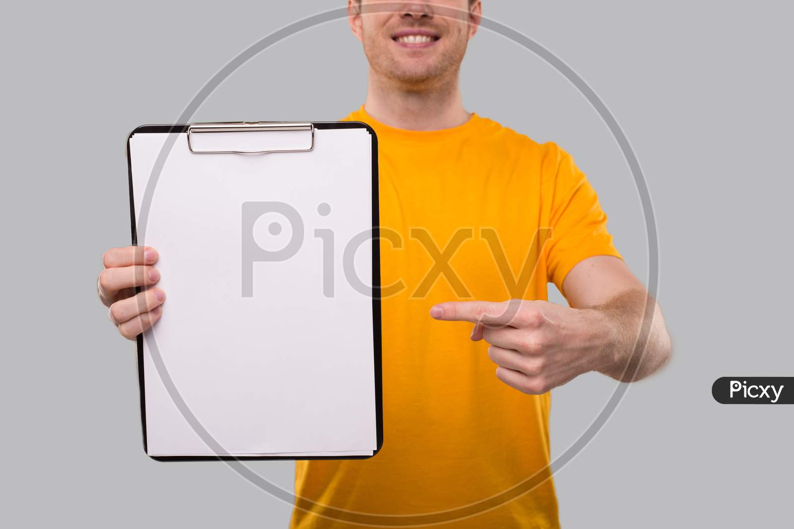 Man Pointing In Clipboard. Blank Clipboard In Hands. Close Up