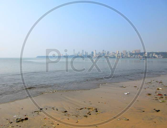 Small Polluted Beach At Mumbai Marine Drive With View Of Mumbai City