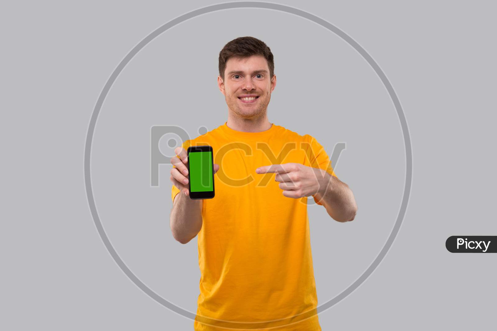 Man Pointing In Phone. Home Delivery. Order Online Technology. Phone Green Screen. Man Smiling