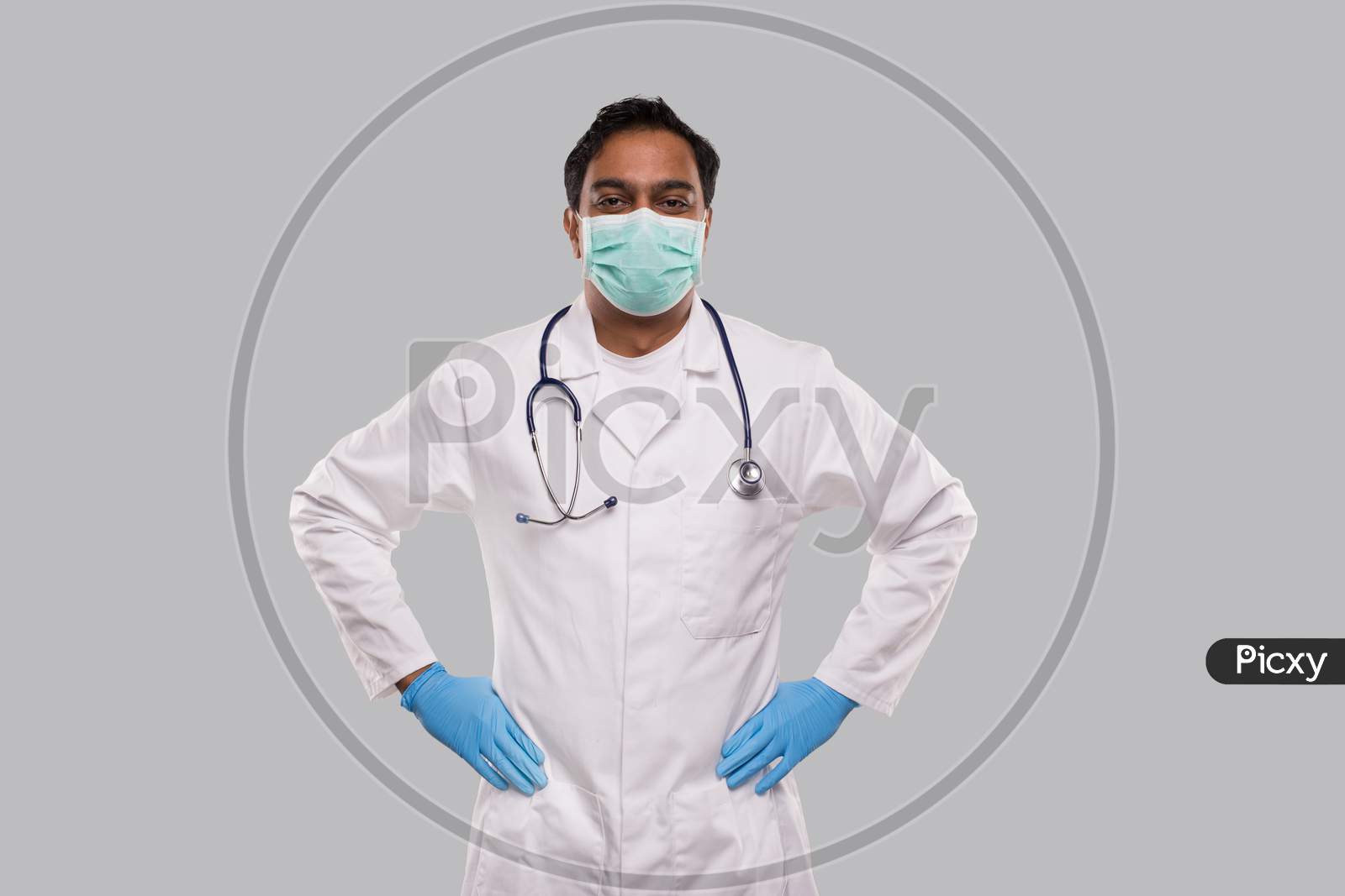 Doctor Wearing Medical Mask And Gloves Isolated. Indian Man Doctor Standing.