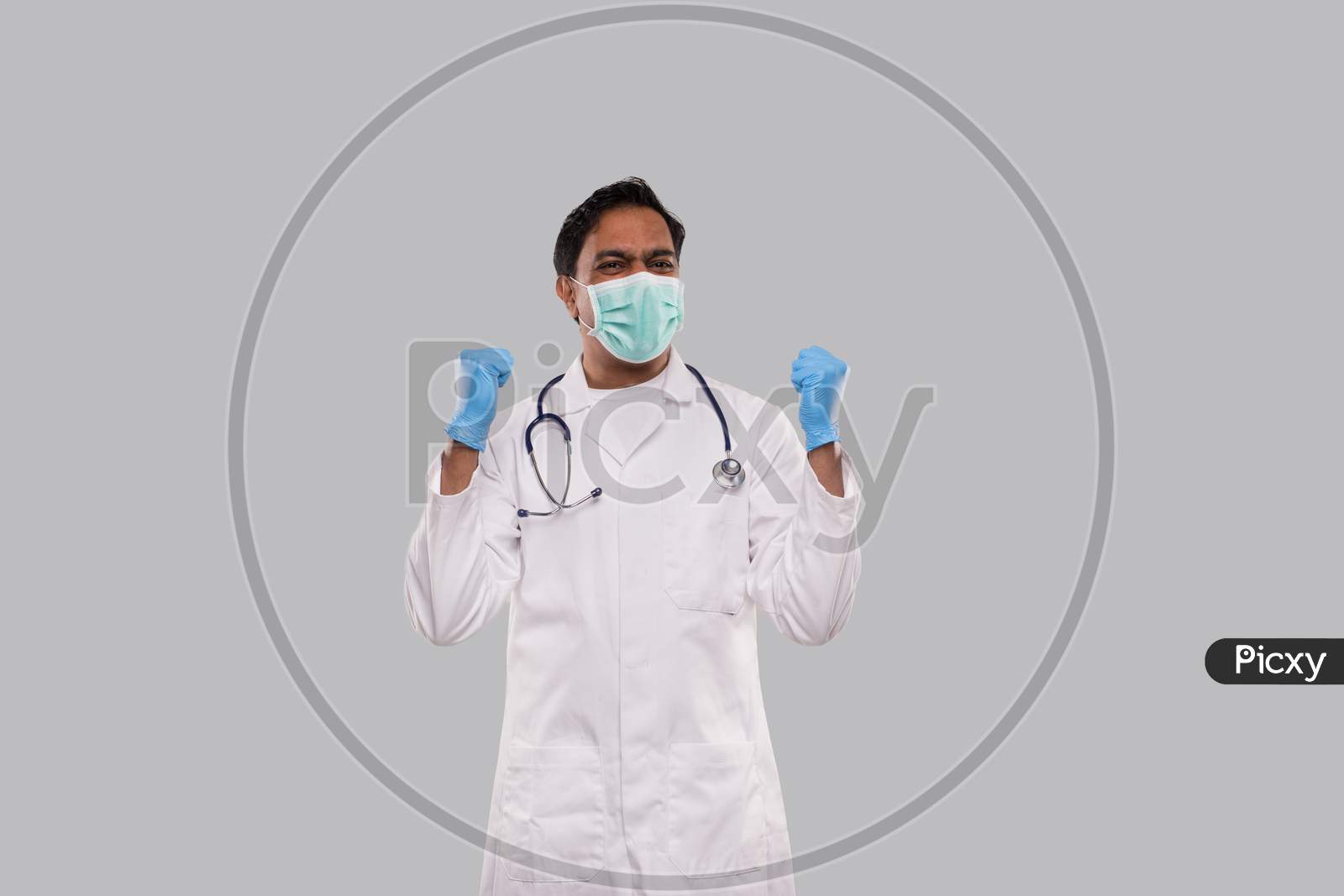 Doctor Excited Celebrating Success Wearing Medical Mask And Gloves Isolated. Indian Man Doctor Happy