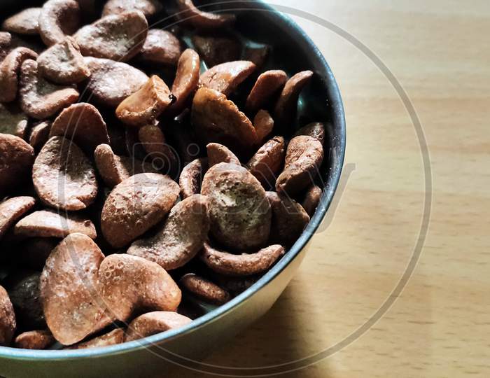 chocolate cornflakes in bowl on table