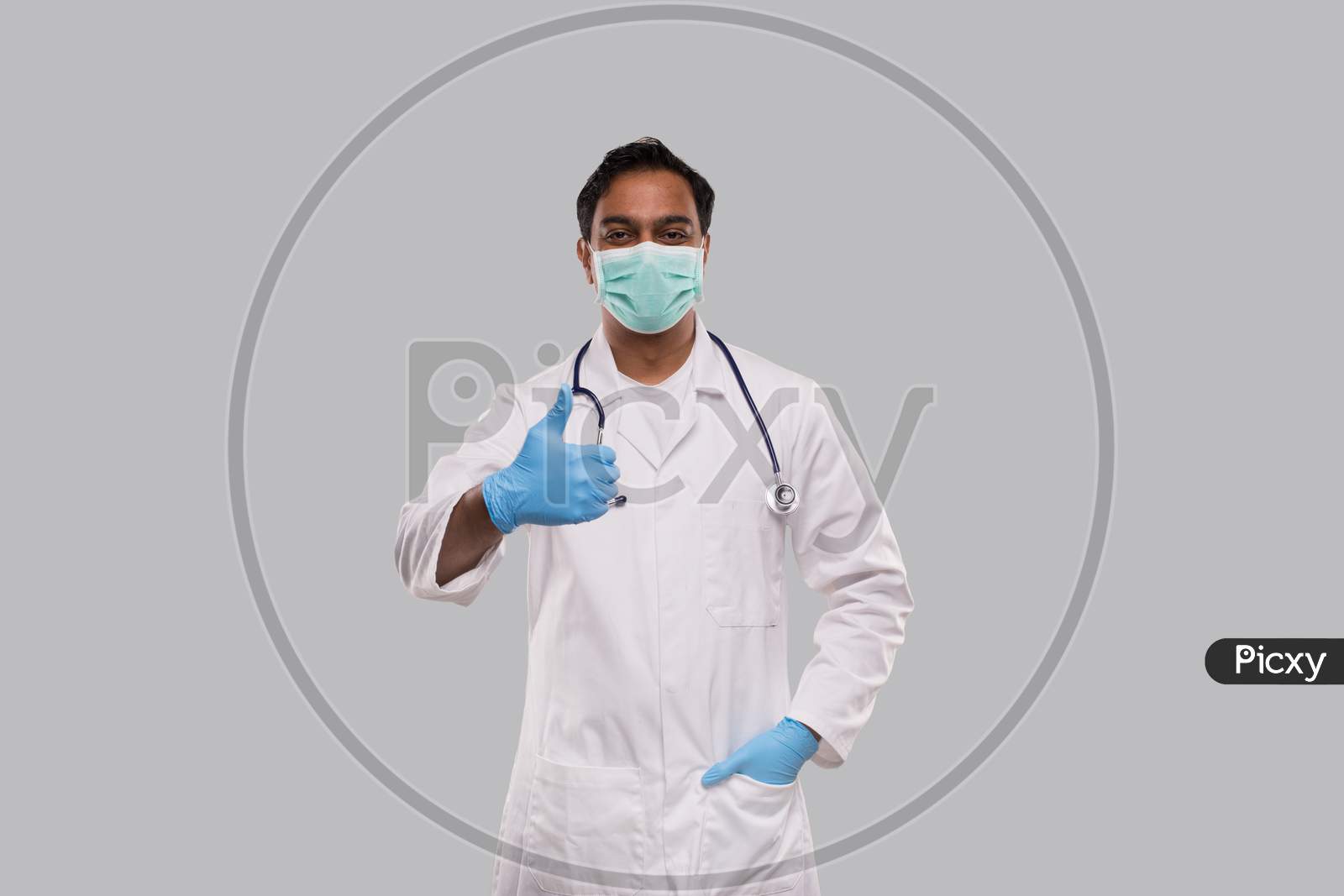 Man Doctor Showing Thumb Up Wearing Medical Mask Isolated. Indian Man Doctor Medical Workwear