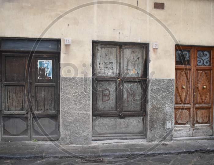 The atmospheric historical aged wooden doors in Florence Italy