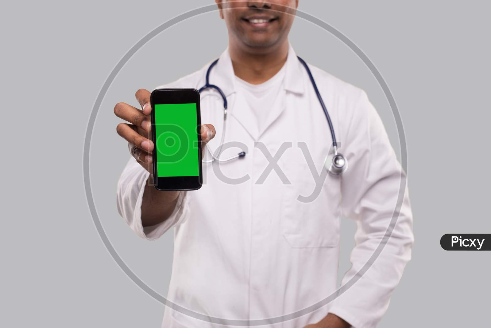 Doctor Holding Phone. Indian Man Doctor Technology Medicine At Home. Phone Green Screen Close Up Isolated