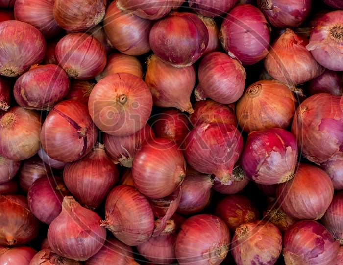 Onion heap in a market for sale