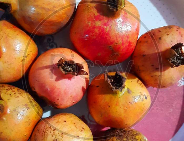fresh organic pomegranate  red fruits closeup