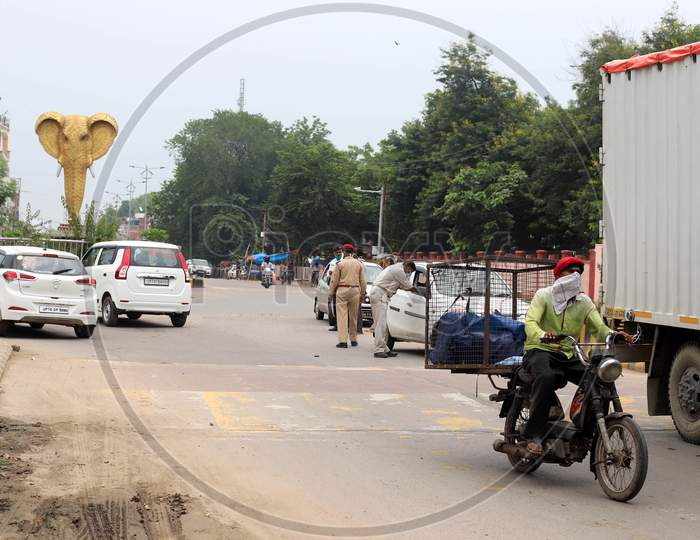 Policeman Checking Vehicles During Lockdown To Slow The Spread Of The Coronavirus Disease (Covid-19) In Prayagraj, July 18, 2020.