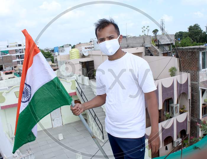 Indian Man Holding Flag In Covid-19