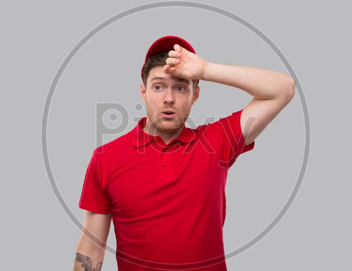 Delivery Man Tired After Work. Delivery Boy Tired Sign. Red Uniform