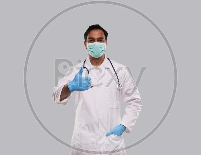 Man Doctor Showing Thumb Up Wearing Medical Mask Isolated. Indian Man Doctor Medical Workwear
