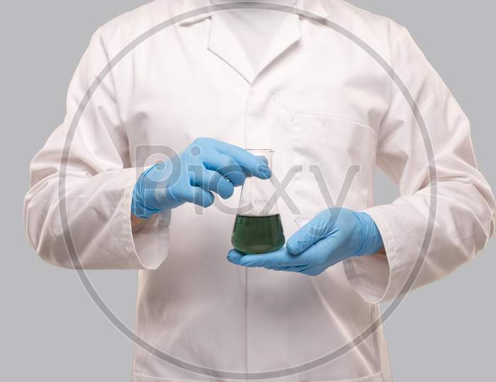 Male Doctor Wearing Gloves Showing Flask With Colorfull Liquid. Science, Medical, Virus Concept