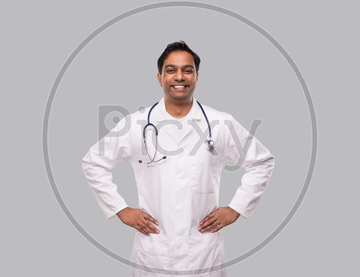 Male Doctor Portrait Standing Smiling Hands To Sides. Isolated. Medical Concept