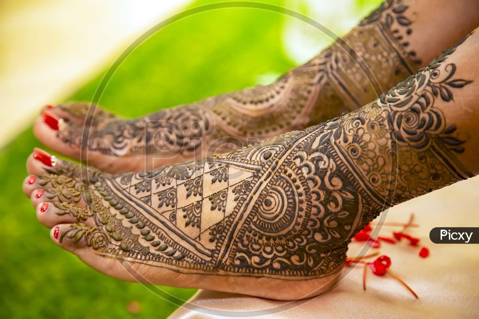 henna on Indian bride's leg.