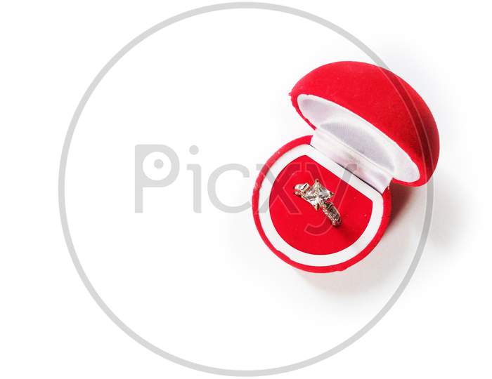 Diamond ring in red box on white background