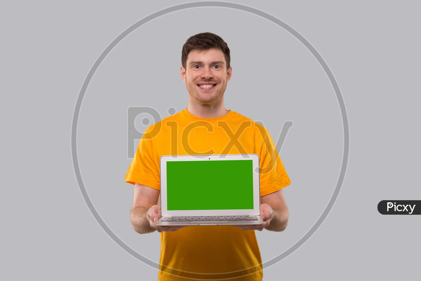 Man Showing Laptop Green Screen. Home Orders, Quarantine Delivery, Shopping Online, Freelance Worker Concept.