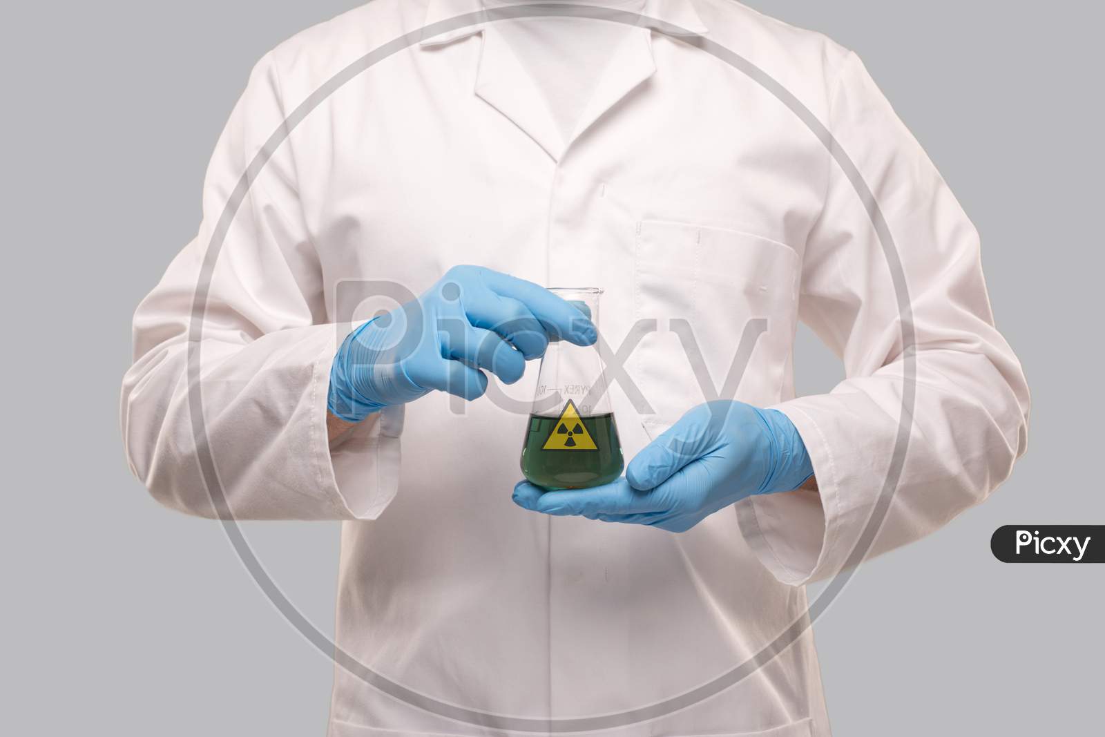 Male Doctor Wearing Gloves Showing Flask With Green Liquid Radiation Sign. Science, Medical, Virus Concept