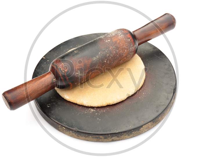 the brown wooden mold with bellan and unleavened bread isolated on  white background.