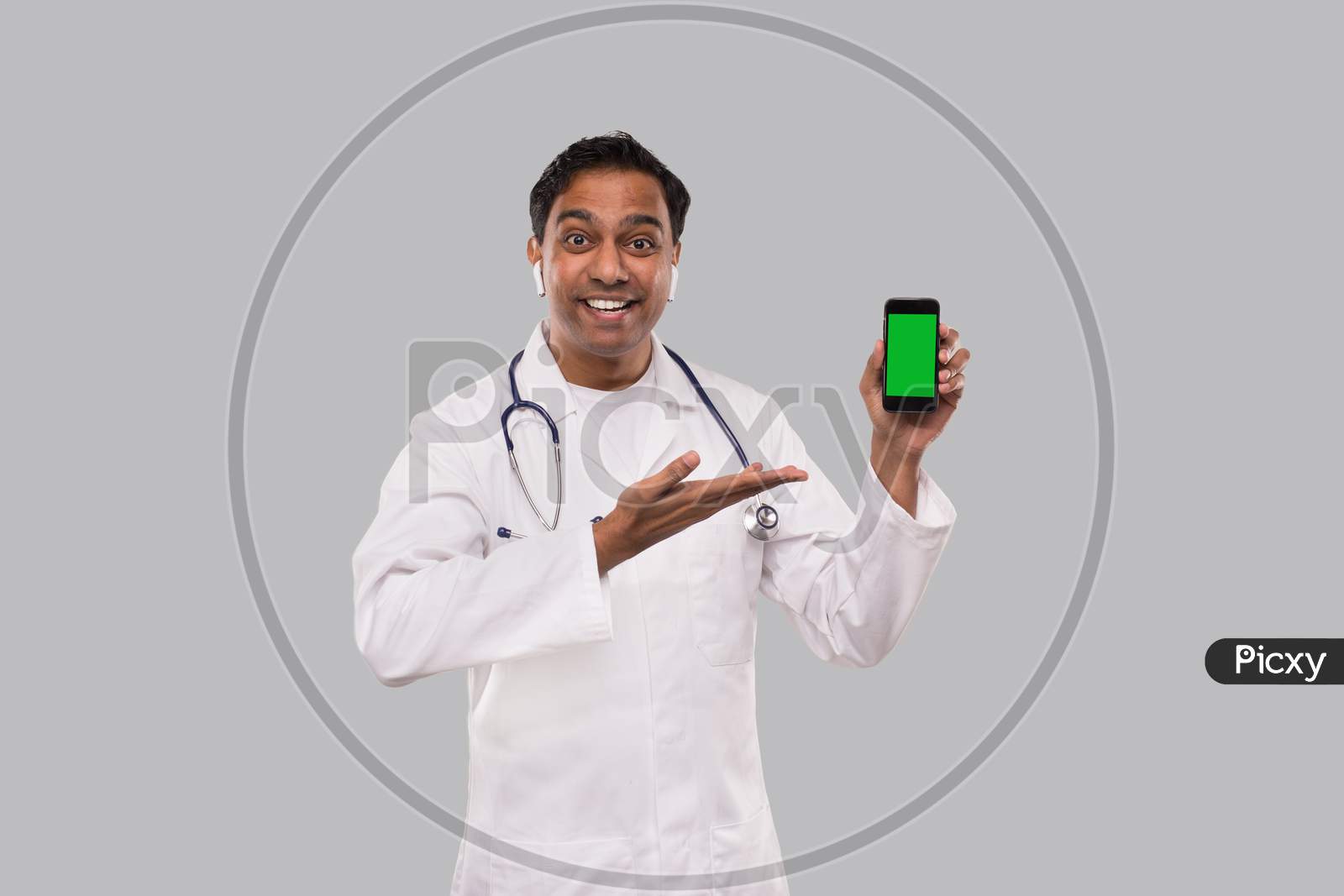 Doctor Showing Phone Smilling. Indian Man Doctor Technology Medicine At Home. Phone Green Screen Close Up Isolated