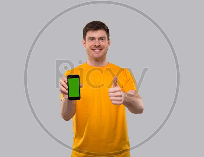 Man Holding Phone Showing Thumb Up. Home Delivery. Order Online Technology. Phone Green Screen.