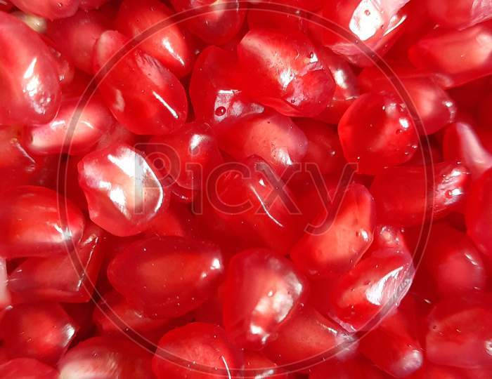 fresh organic pomegranate   fruits seeds  closeup