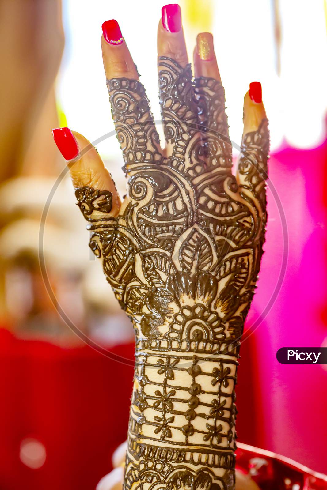 creative mehendi design on bride hand.