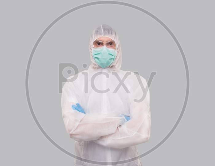 Male Laboratory Worker Wearing Medical Mask, Gloves And Chemical Suit. Man Hands Crossed Anti Virus.