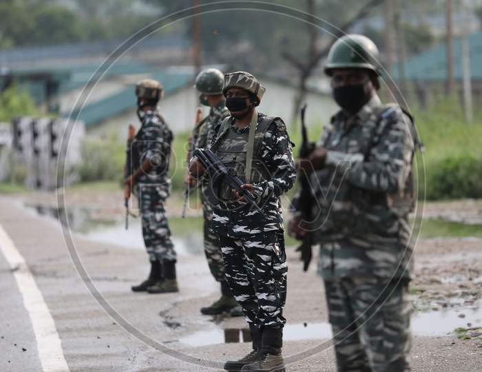 Soldiers belonging to the Central Reserve Police Force unit stand guard on the Jammu & Kashmir National Highway ahead of the start of the Amarnath Yatra in Jammu on July 19, 2020