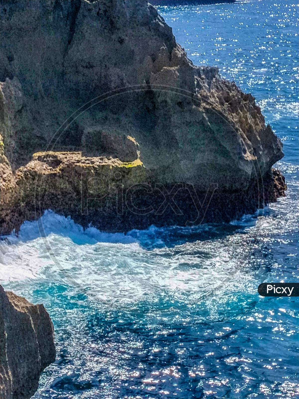 Beautiful Angel'S Billabong View. Sharp Dramatic Rocks And Crashing Waves At The Entrance To Angel'S Billabong On Nusa Penida, Wonderful Angels Billabong At Nusa Penida, Bali Indonesia, Angel'S Billabong Is Natural Infinity Pool On The Island
