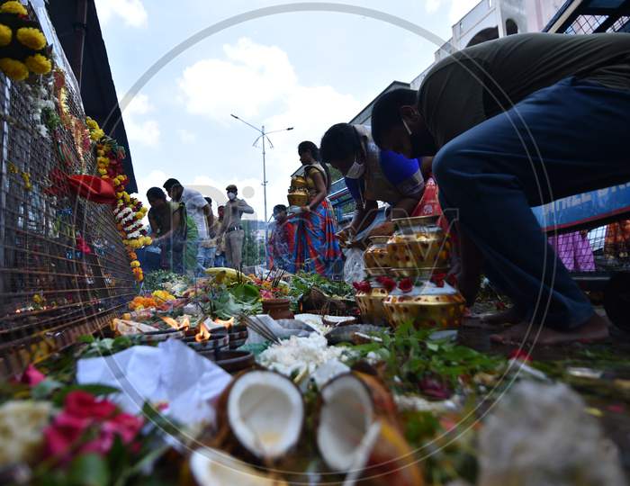 Devotees offer 'Bonam' outside a closed Yellamma Pochamma Temple amid coronavirus fears on July 19, 2020, Balkampet, Hyderabad, Bonalu 2020.