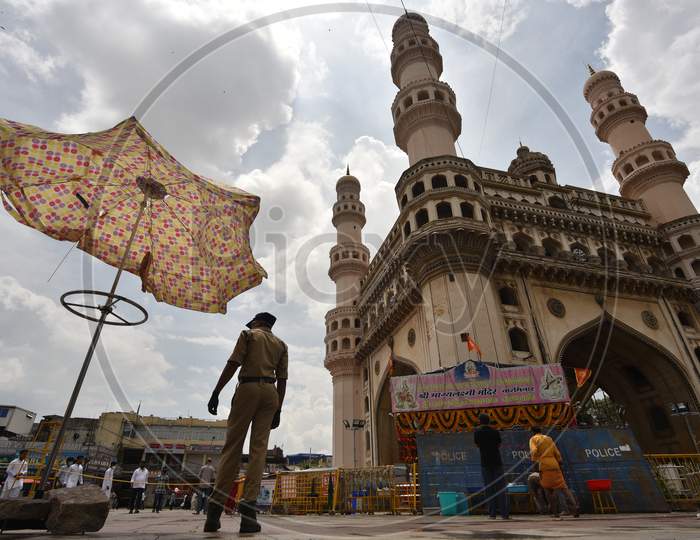 A Police Constable stands guard at the Closed Bhagyalakshmi Temple at Charminar  amid raising concerns of Coronavirus on July 19, 2020, Hyderabad, Bonalu 2020.