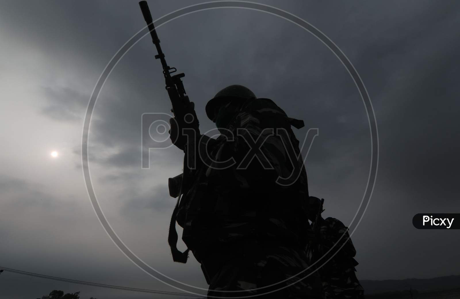 Soldiers belonging to the Central Reserve Police Force unit stand guard on the Jammu & Kashmir National Highway ahead of the start of the Amarnath Yatra in Jammu on July 19, 2020