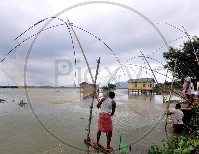 Villagers trying to fish in the flood-affected areas in Morigaon, Assam on July 18, 2020
