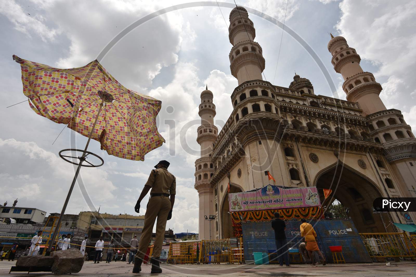 A Police Constable stands guard at the Closed Bhagyalakshmi Temple at Charminar  amid raising concerns of Coronavirus on July 19, 2020, Hyderabad, Bonalu 2020.