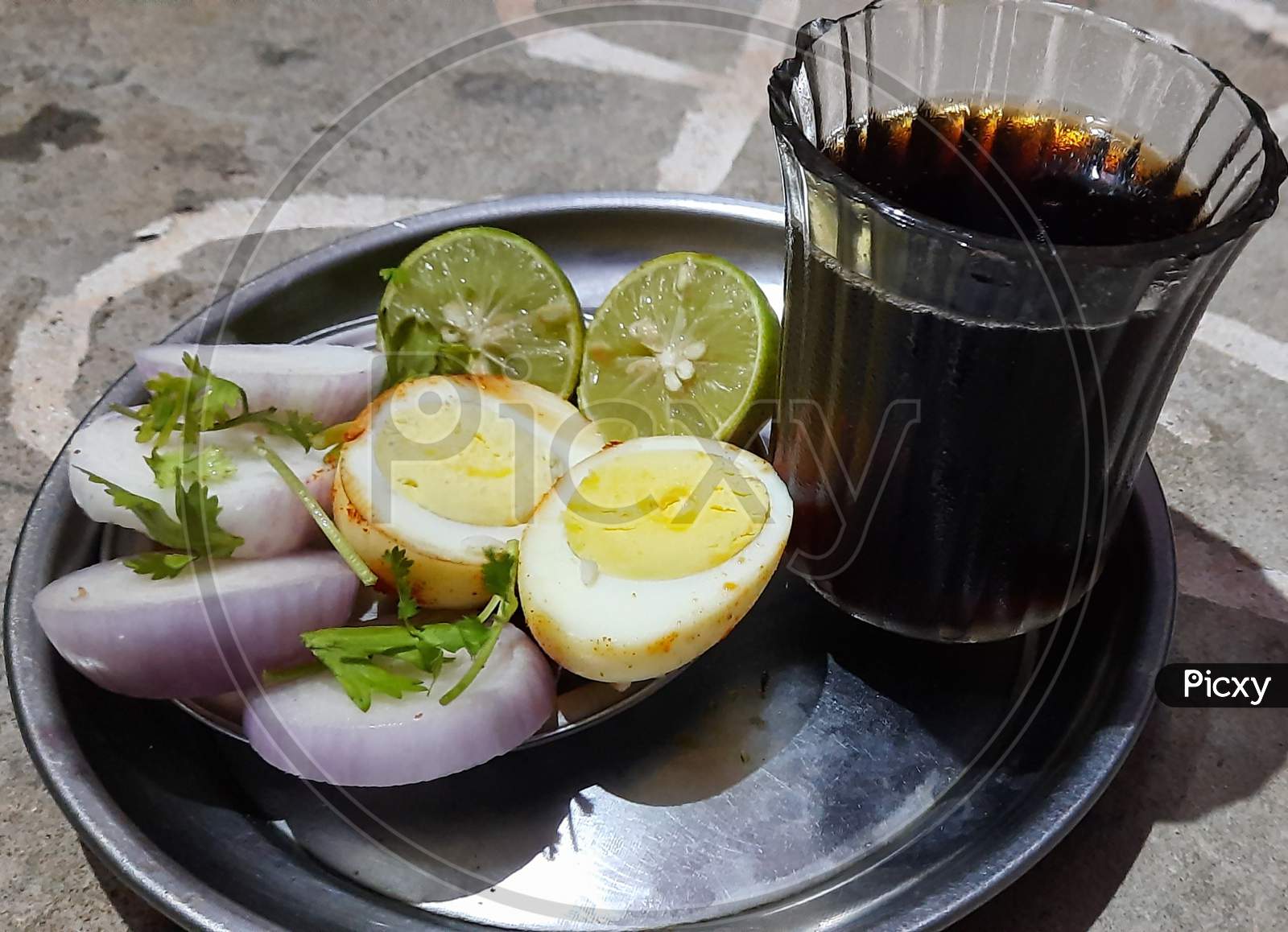 Masala egg with onion and lemon