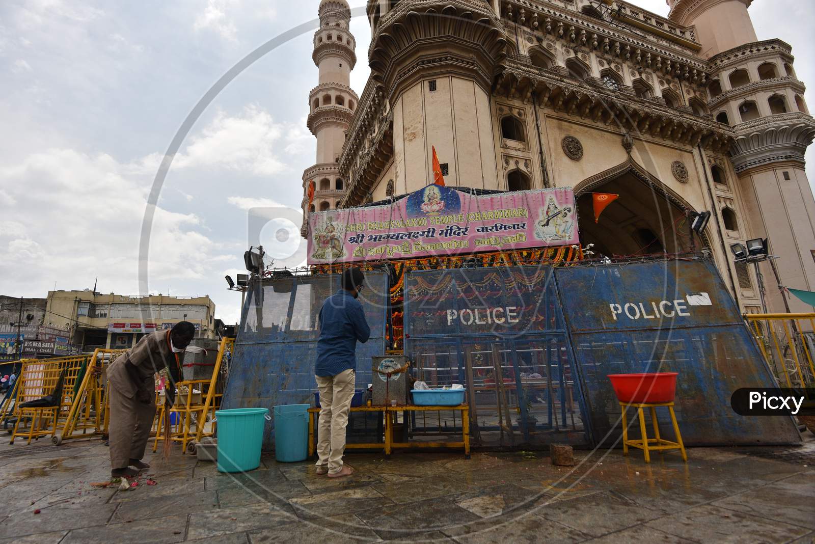 A man prays in front of the Closed Bhagyalakshmi Temple at Charminar  amid raising concerns of Coronavirus on July 19, 2020, Hyderabad, Bonalu 2020.