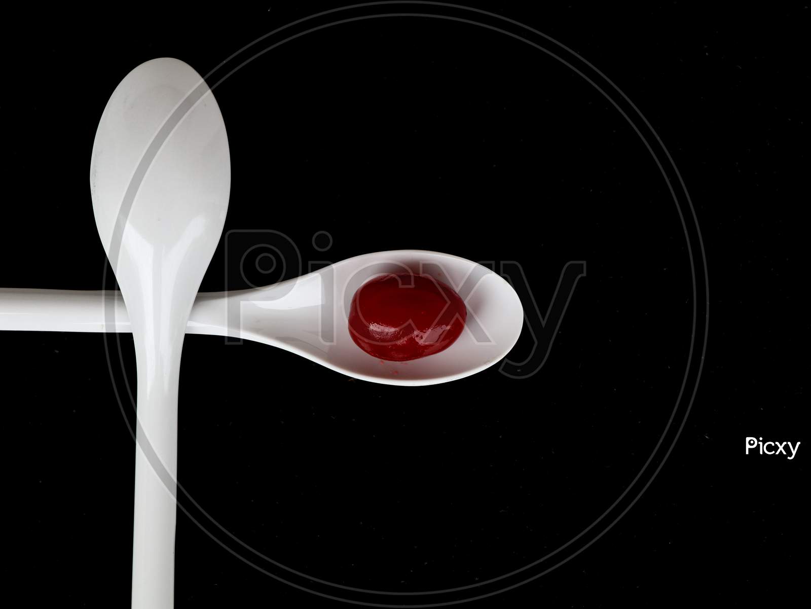 Red Color Cherry Fruits In A White Spoon Against Dark Background, With Copy Space, Caption