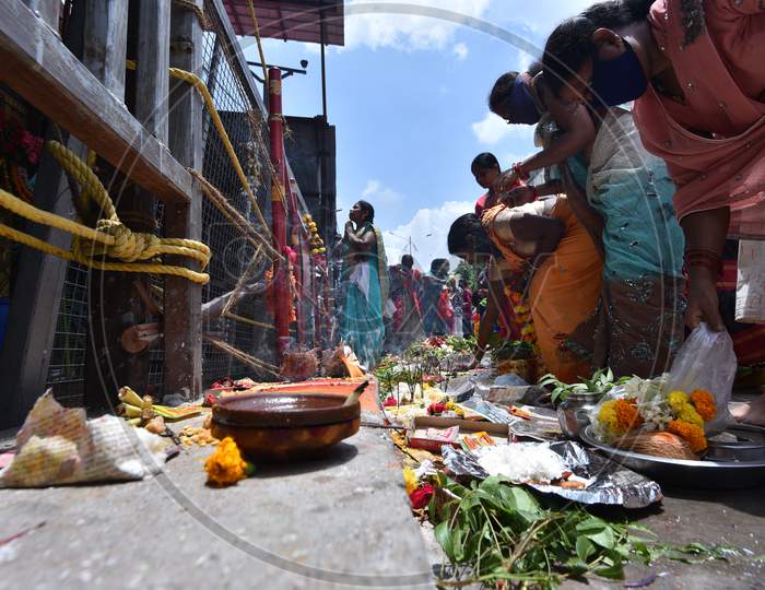 Women offer their 'Bonam' outside a closed Yellamma Pochamma Temple amid raising fears of coronavirus, July 19, 2020, Balkampet, Hyderabad, Bonalu 2020.