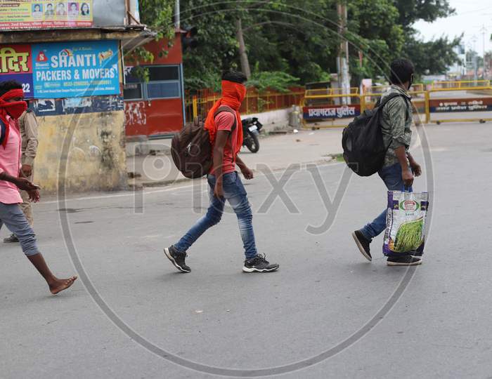 People Walk On The Empty Road during Total Lockdown Imposed By Uttar Pradesh Government Due To Surge In Covid-19 Cases In Prayagraj, July 19, 2020.
