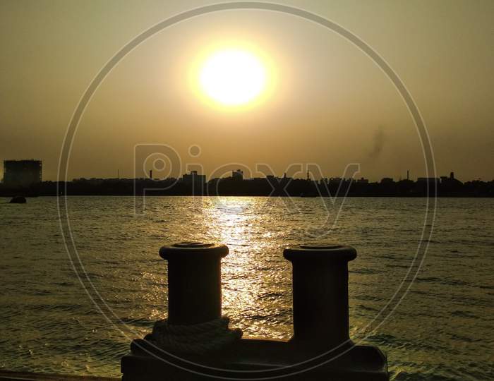 Sunset view standing on the banks of the Ganges.The water of the Ganges is glistening in the sunlight