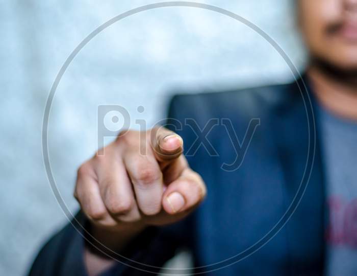 Young man pointing his finger