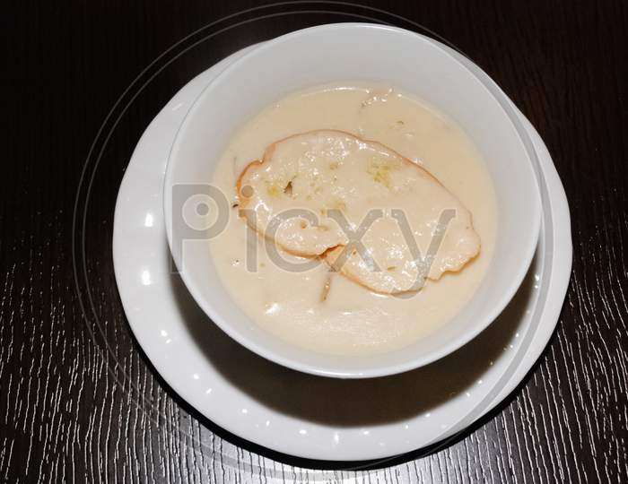 Shiny Creamy Mushroom Soup In The White Bowl