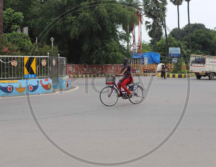 A Girl Cycling On The Empty Road, The Total Lockdown Imposed?By Uttar Pradesh Government?Due To Surge In Covid 19 Cases In Prayagraj, July 19, 2020.