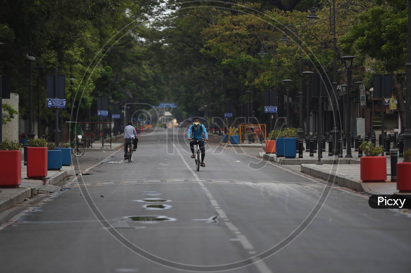 A man pedals his bicycle on a deserted road after the Government imposed a total lockdown in Chennai