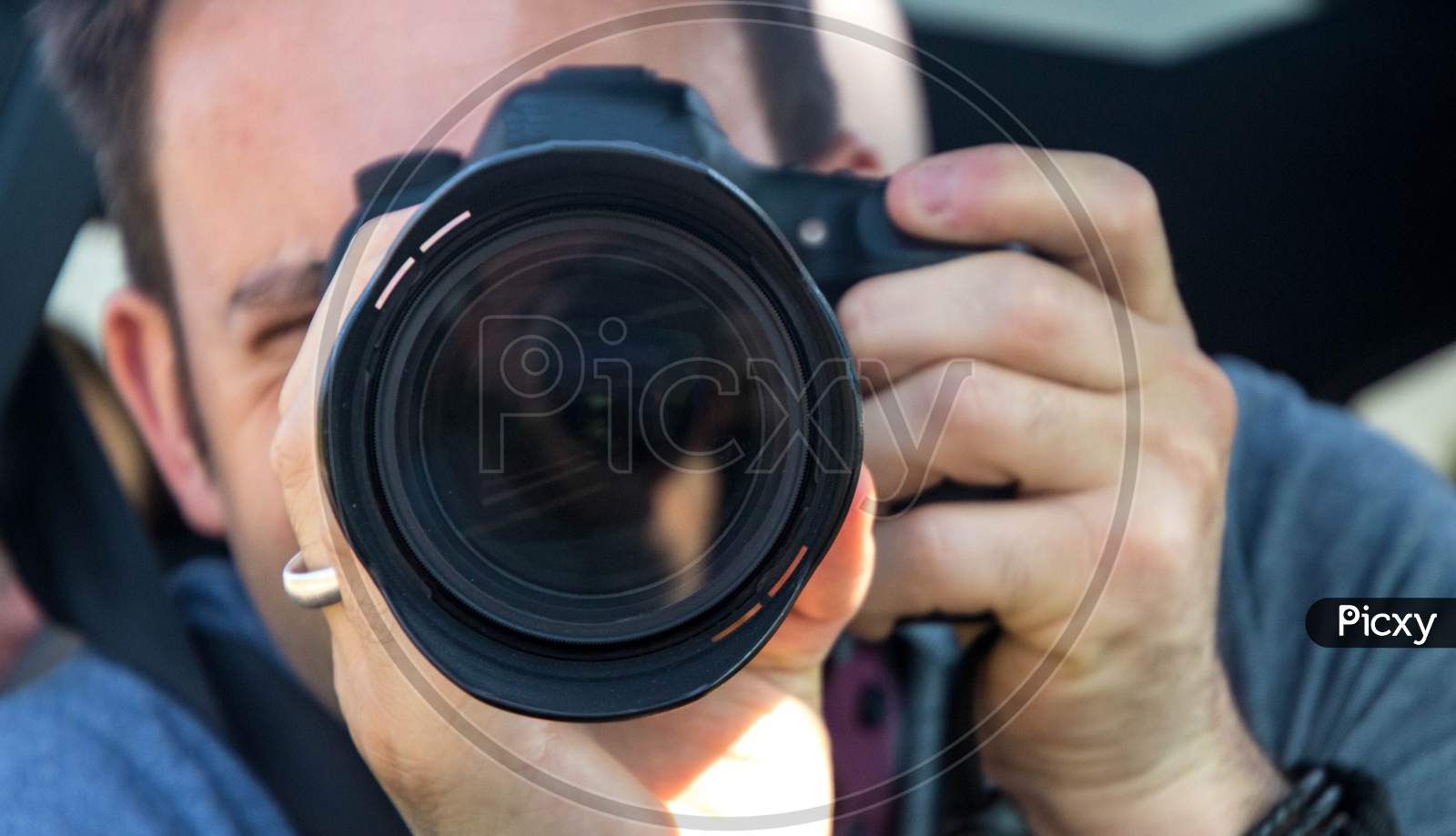 Photographer Through The Lens