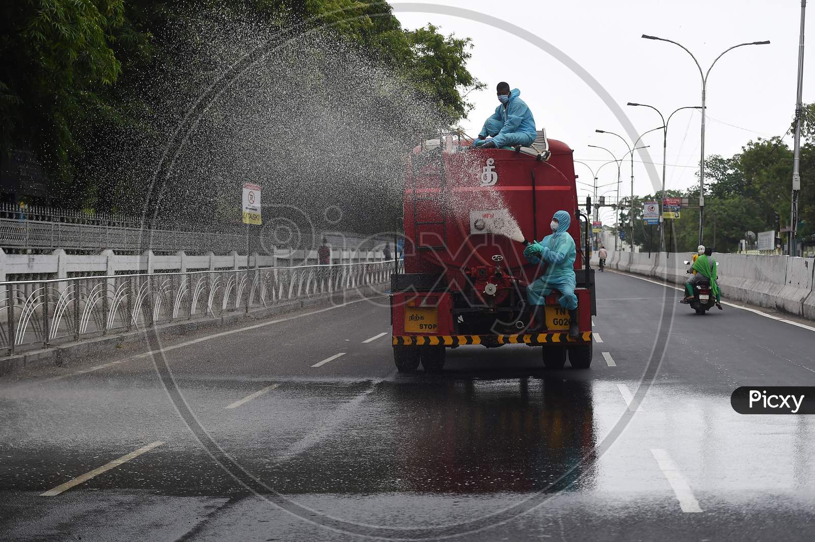 Firefighters spraying disinfectant in a containment zone as a preventive measure to contain the spread of Coronavirus in Chennai.