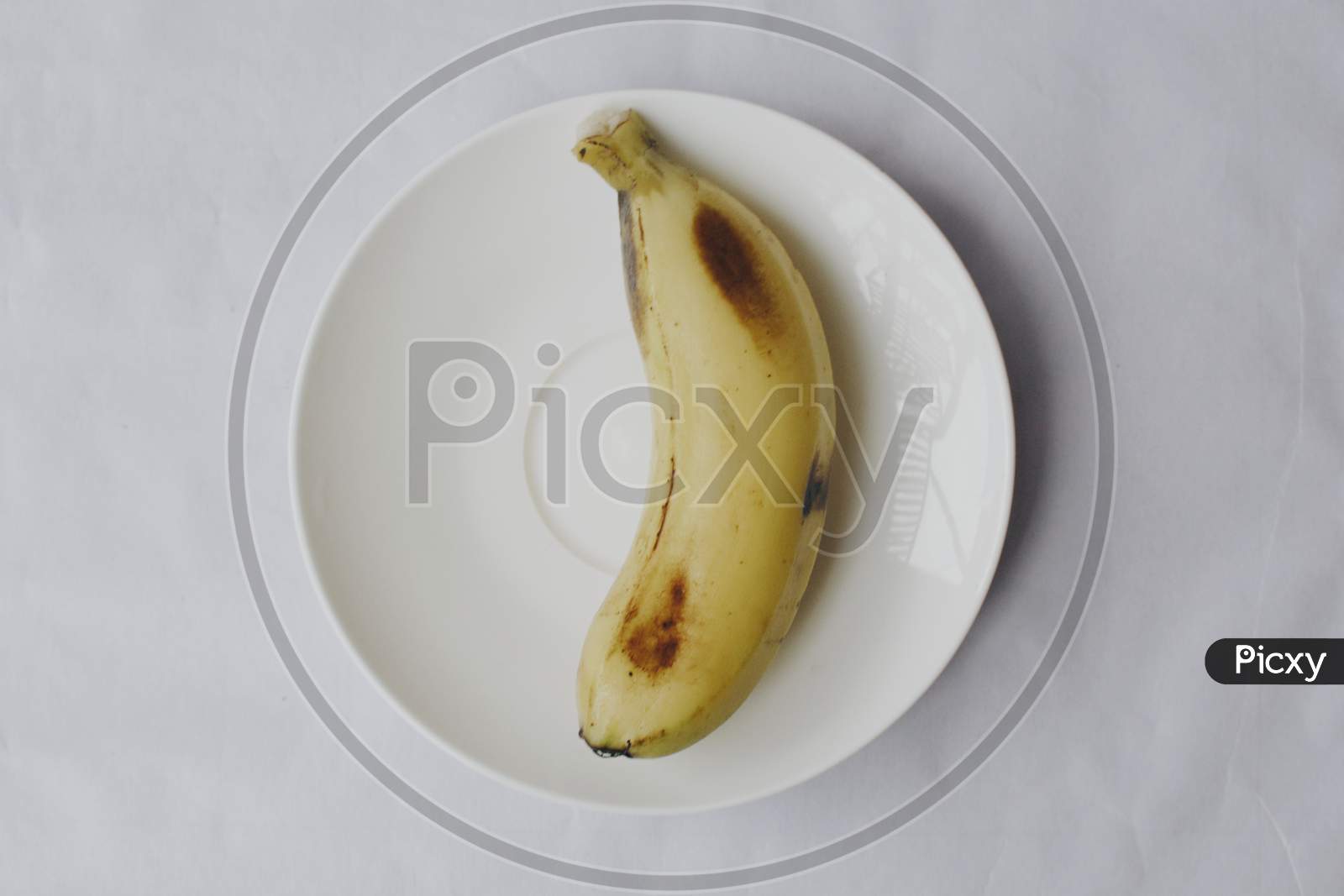 Fresh Banana on white plate