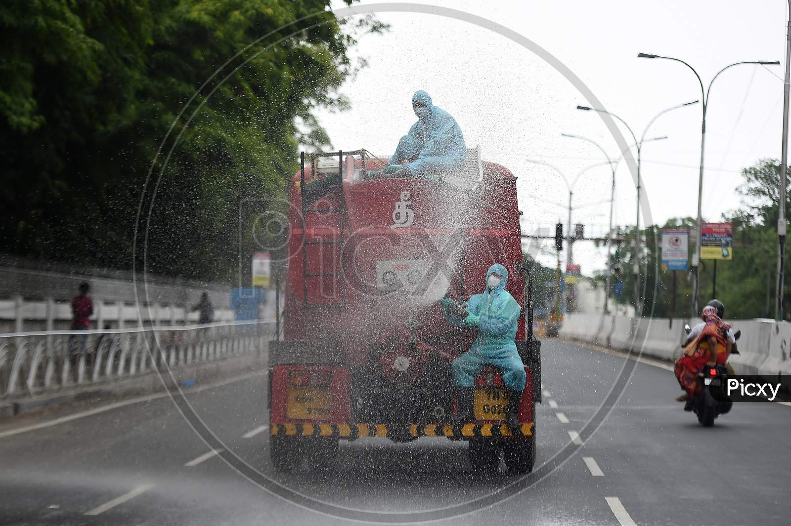 Firefighters spraying disinfectant in a containment zone as a preventive measure to contain the spread of Coronavirus in Chennai.